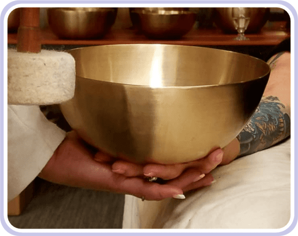 Tibetan bowl being held
